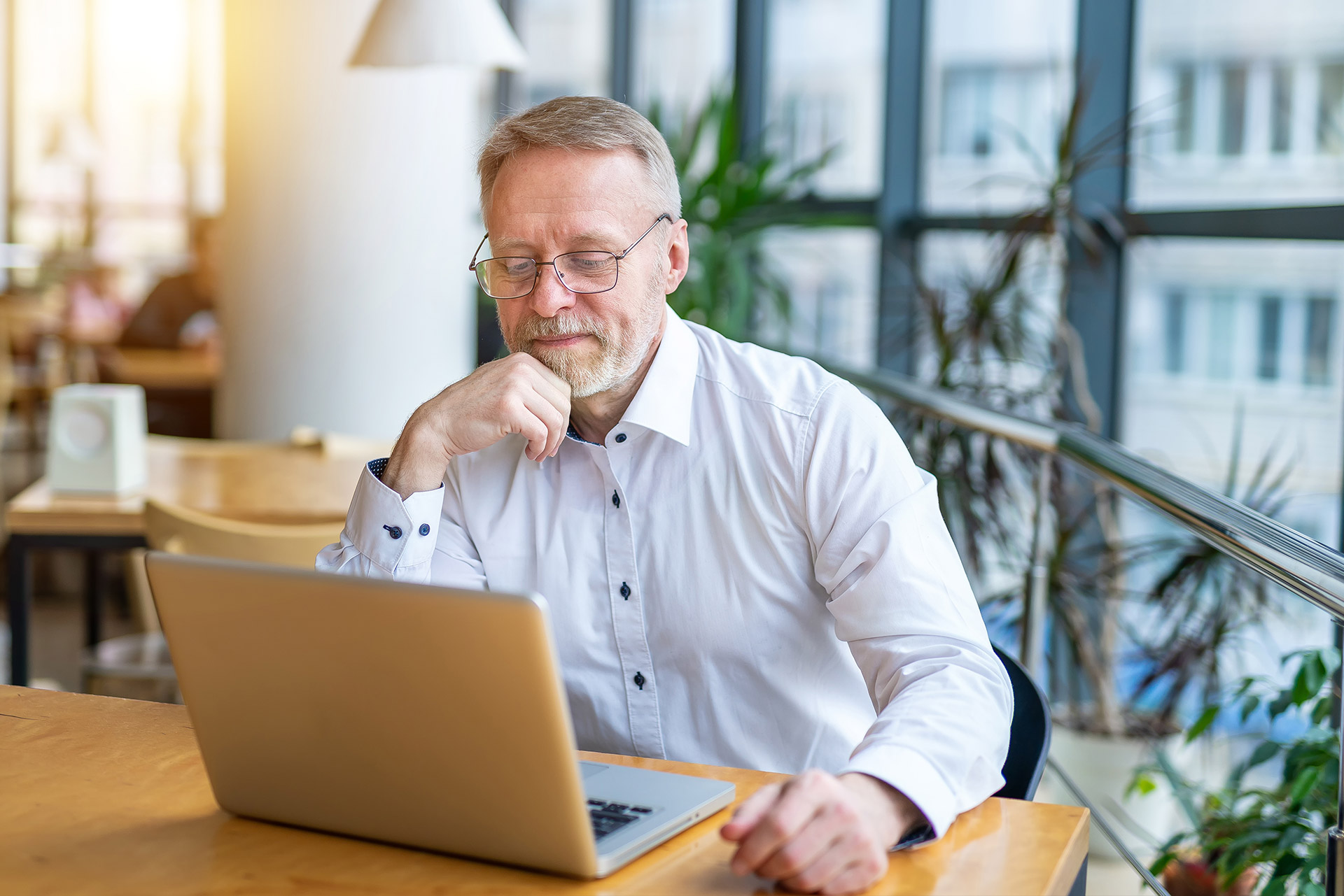 Man smiling as he checks his email